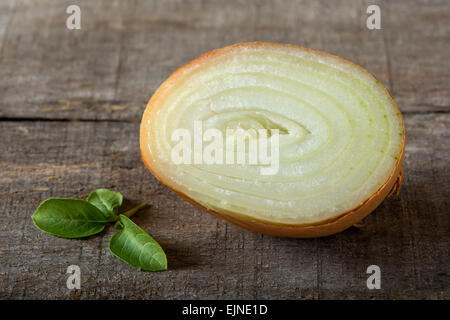 White onion and basil on a wood background Stock Photo