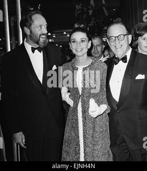 Actress Audrey Hepburn arrives for the premiere of My Fair Lady in New York with husband Mel Ferrer (left) and Stan Holloway who also stars in the film. 21st October 1964. Stock Photo