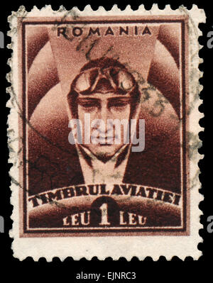 ROMANIA - CIRCA 1932: Stamp printed in Romania shows pilot, with inscription 'Timbrul Aviatiei' Stock Photo