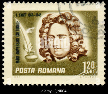 ROMANIA - CIRCA 1967: Stamp printed in Romania shows Jonathan Swift, the Irish satirist, essayist Stock Photo