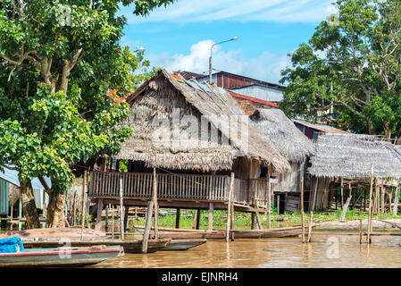 Small shacks on stilts in the Amazon River in Tamshiyacu near Iquitos, Peru Stock Photo