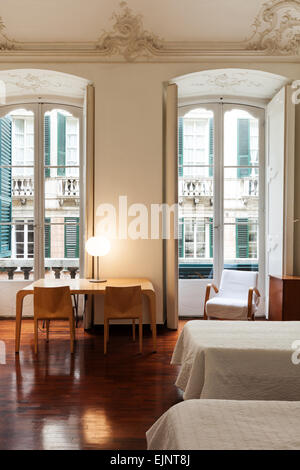 beautiful interior of hotel in historic palace, view bedroom Stock Photo
