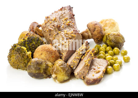 Roast beef with vegetables isolated on white background. Grilled mushrooms, broccoli and brussels sprouts with sliced meat. Reci