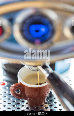 latte or cappuccino home coffee making from DeLonghi Prima Donna Elite  espresso maker Stock Photo - Alamy