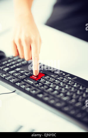 hand pressing success button on keyboard Stock Photo