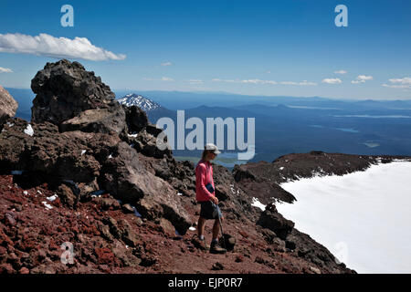 OREGON - Hiker on the rim of the summit crater of South Sister in the Three Sisters Wilderness in Deschutes National Forest. Stock Photo