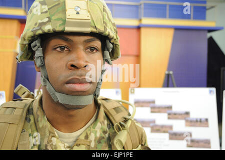 Spc. Eddie L. Williams, a computer detection repairer at Fort Belvoir, Va., models the new MultiCam Army Combat Uniform, which will be issued to Soldiers deploying to Afghanistan beginning in July.         Soldiers deploying to Afghanistan to get new MultiCam uniforms, boots, gear  /-news/2010/03/02/35184-soldiers-deploying-to-afghanistan-to-get-new-multicam-uniforms-boots-gear/index.html Stock Photo