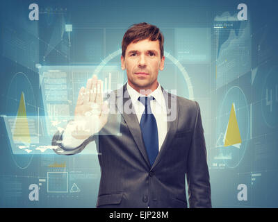 attractive buisnessman wotking with virtual screen Stock Photo