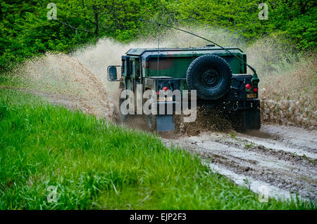 Reserve Soldiers from the greater Chicago area drive M1165A1 High Mobility Multi-purpose Wheeled Vehicles HMMWV on an off-road driving course to gain practice on the HMMWV in various rough terrain conditions at the Joliet Training Area, Ill., May 14. The course was taught by driving instructors from the 416th Theater Engineer Command, headquartered in Darien, Ill. Approximately 30 Soldiers participated in the driver training, which spans across a five-day training schedule.  Sgt. 1st Class Michel Sauret Stock Photo