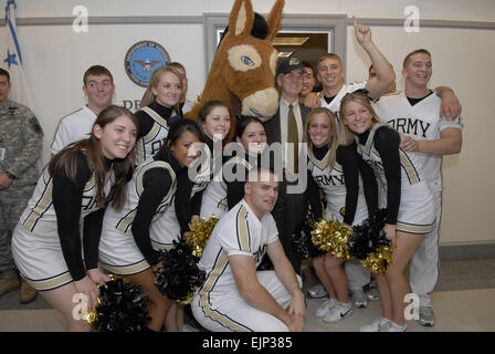 Deputy Secretary of Defense Gordon England poses with the Army West Point cheerleaders as they marched through the Pentagon Nov. 30, 2007, in anticipation of the upcoming Army-Navy football game.   Mass Communication Specialist 2nd Class Molly A. Burgess Stock Photo