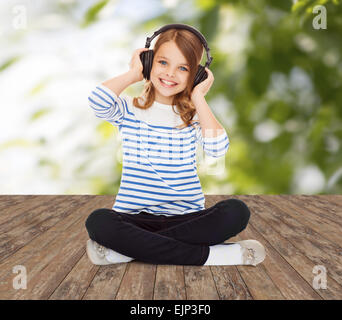 happy girl with headphones listening to music Stock Photo