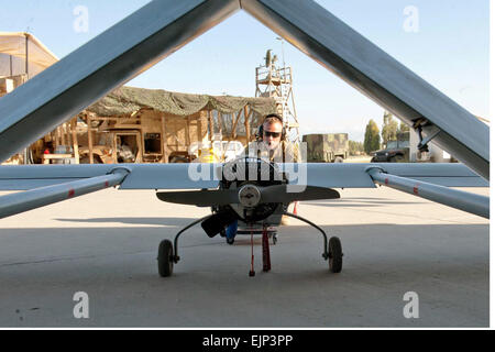 U.S. Army Spc. Tyler Brewer performs a pre-flight inspection on an RQ-7B Shadow at Forward Operating Base Fenty, Afghanistan, May 2, 2013.  Spc. Margaret Taylor Stock Photo