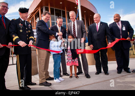 Senior military and civilian leaders gather to cut the ribbon at the dedication ceremony for Seitz Elementary School, Sept. 14, 2012, Fort Riley, Kan. Honored guests cutting the ribbon were, from left, Mike Steiner, managing director, Picerne Military Housing; Brig. Gen. Donald MacWillie, senior commander, Fort Riley; Kansas Gov. Sam Brownback; Jawheim Flournoy, kindergartener at Seitz Elementary School; retired Lt. Gen. Richard Seitz; Alyssa Thompson, kindergartener at Seitz Elementary School; U.S Sen. Jerry Moran R-KS; Under Secretary of the Army Joseph W. Westphal; and Ronald Walker, superi Stock Photo