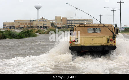 Miss. Army National Guard soldiers travel through storm surge to assist Hancock County Sheriff Deputies make contact with civilians stranded near the Mississippi Gulf Coast, Aug. 28, in Waveland, Miss. Stock Photo