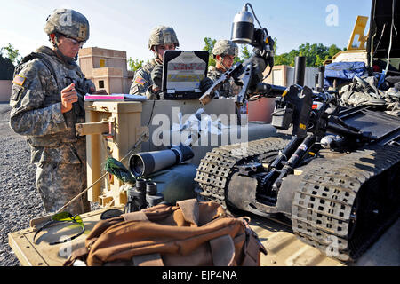 Soldier prepare their gear for a test during the 20th Support Command CBRNE Explosive Ordnance Disposal Team of the Year competition Sept. 16, 2012 at Fort Knox, Ky. From left are Sgt. Matthew Bagley, Staff Sgt. Christopher Thompson and Staff Sgt. Josue Sandoval. Dod photo by EJ Hersom Stock Photo