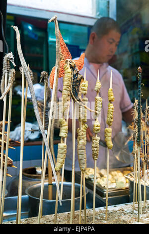 China, Beijing, exotic food on skewers, Wangfujing street night market Stock Photo