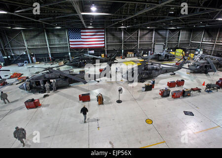 New Jersey Army National Guard maintainers with the 1-150th Assault Helicopter Battalion prepare UH-60 Black Hawk helicopters for further search and rescue missions following the passing of Hurricane Sandy Oct. 30, 2012.   Master Sgt. Mark C. Olsen Stock Photo