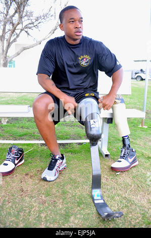 Sgt. Jerrod Fields, a U.S. Army World Class Athlete Program Paralympic sprinter hopeful, changes his prosthesis before running a track workout at the U.S. Olympic Training Center in Chula Vista, Calif.   Tim Hipps, FMWRC Public Affairs         Below-knee amputee runs for berth in 2012 Paralympics  /-news/2009/07/22/24737-below-knee-amputee-runs-for-berth-in-2012-paralympics/ Stock Photo