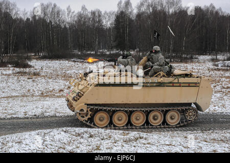 U.S. Army soldiers, assigned to Bravo Company, 1st Battalion, 4th Infantry Regiment, engage a target from a M113A2 armored vehicle during squad maneuver training at Grafenwoehr Training Area on Jan. 14, 2013. The soldiers of 1-4 Infantry are U.S. Army Europe's professional opposing force for training at the 7th Army Joint Multinational Readiness Center in Hohenfels, Germany.  They routinely hone their skills at Grafenwoehr's multi-functional live-fire facilities.  Staff Sergeant Pablo N. Piedra/released