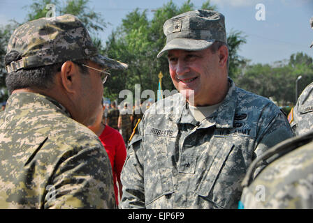 Brig. Gen. Kenneth Roberts, the Third Army/ARCENT Director of Operations, is greeted by General-Lieutenant Saken Zhasuzakov, the Kazakhstan Chief of Defense, during the opening ceremony for Steppe Eagle 2013 at Iliskiy Training Center on Aug. 10. Steppe Eagle is an annual, multi-national exercise, which is conducted by the Kazakhstan Peacekeeping Brigade and Battalion, the Arizona Army National Guard, the 1st Armored Brigade Combat Team, 4th Infantry Division, and Third Army/ARCENT. The exercise will help build strong alliances while allowing more than 1,000 participants from seven militaries  Stock Photo