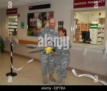 Brig. Gen. James Gilman, commander of Brooke Army Medical Center and Great Plains Regional Medical Command, and Col. Thirsa Martinez, director of the Department of Pharmacy at BAMC, cut a ribbon April 14 signifying the opening of the Warrior Pharmacy, which was designed to create more time with the Warrior and their Families for medication therapy.  Jen Rodriguez Stock Photo