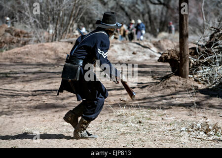 Union Army soldier running with rifle, Civil War reenactment, near Socorro, New Mexico USA Stock Photo