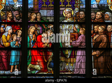 Stained Glass Window depicting Saint Wilibrord baptising the Frank Aengilbert in Den Bosch Cathedral, North Brabant. Stock Photo