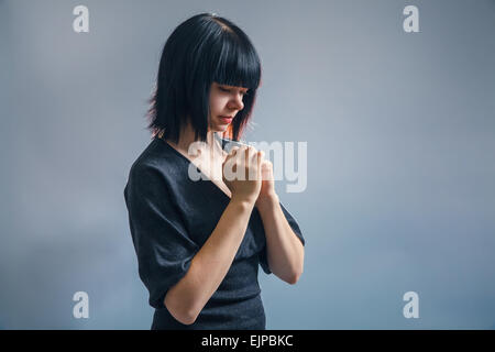 European-looking girl of about twenty brunette in a black jacket Stock Photo