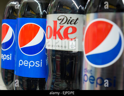 Bottles of Pepsi and Diet Coke in a grocery store in New York on Thursday, March 26, 2015. With overall consumption of soft drinks down in the U.S. Pepsi-Cola has taken the number 2 slot by volume from Diet Coke. Good old-fashioned Coke remains number 1 at 17.6% market share. (© Richard B. Levine) Stock Photo