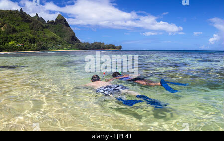 Snorkelers at Tunnels Beach on Kauai Stock Photo