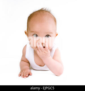 Cute baby looking surprised Stock Photo