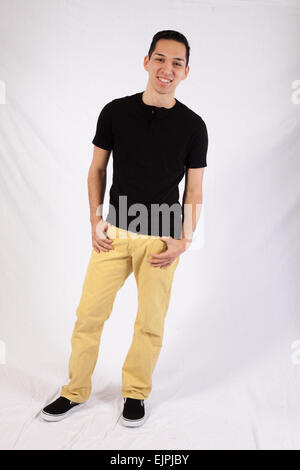 Young man in black shirt, looking happy Stock Photo