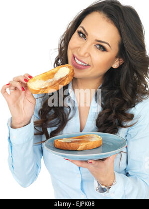 Attractive Young Woman Eating Hot Buttered Toast Stock Photo