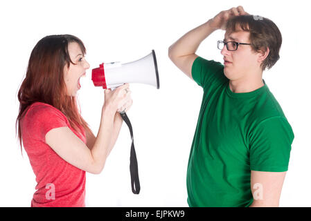 Woman Shouting to her Man with Megaphone Stock Photo