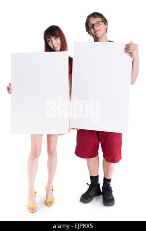 Smiling Young Couple Holding Empty Card Boards Stock Photo