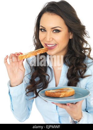 Attractive Young Woman Eating Hot Buttered Toast Stock Photo