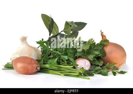 garlic,onions and shallots with herbs on white background Stock Photo