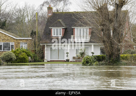 Floodwater in house garden during river flood, River Thames, Chertsey, Surrey, England, February 2014 Stock Photo