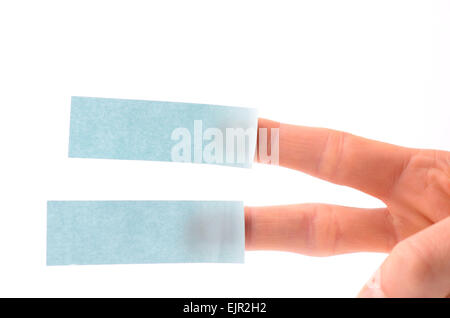 Male hand with two blue sticky notes on a white background Stock Photo