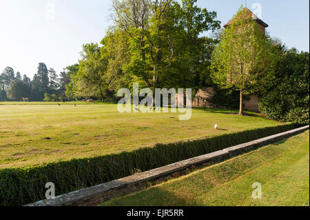 An English country house garden - a ha-ha between the house and the park keeps livestock out without interrupting the view Stock Photo