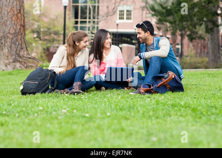 Students using laptop on campus Stock Photo