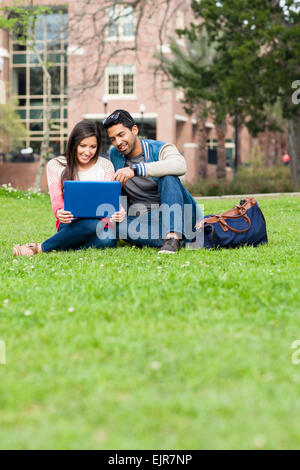 Students using laptop on campus Stock Photo