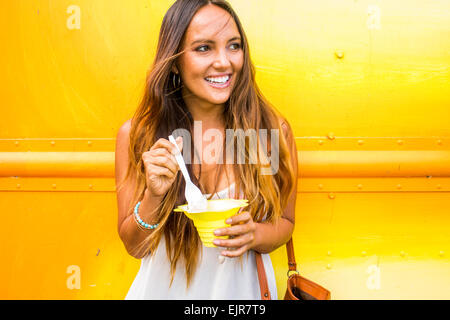 Caucasian woman eating shaved ice