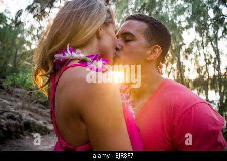 Couple kissing on beach Stock Photo
