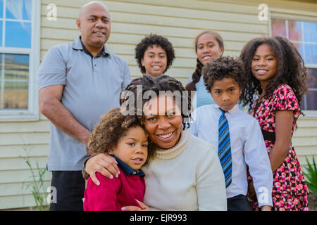 Pacific Islander family smiling outdoors Stock Photo