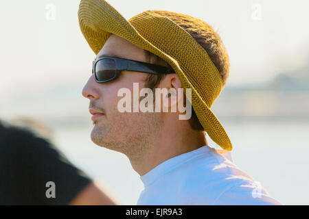 Caucasian man wearing sun hat and sunglasses Stock Photo