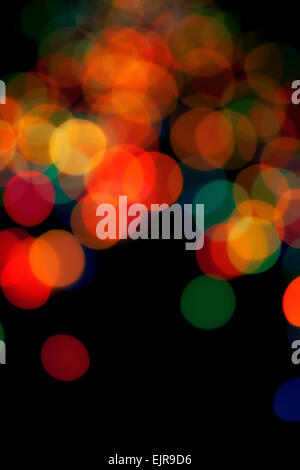 Black abstract background with colorful blurred lights Stock Photo