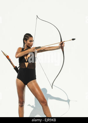 Premium Photo | 3D Render of an archer boy with bow and arrow pose