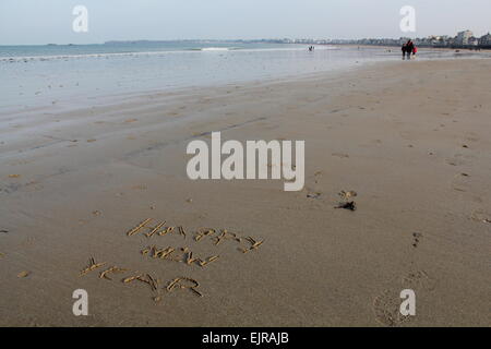 Happy New Year, Written in Sand at the Seashore Stock Photo