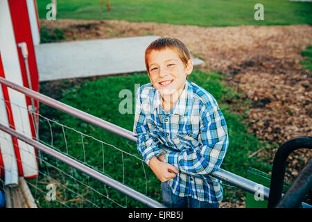 Caucasian boy smiling on farm Stock Photo